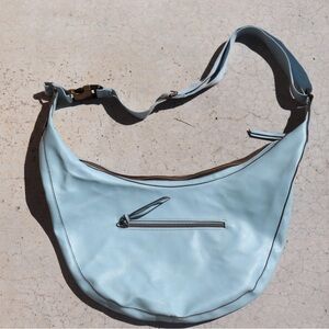 Light Blue Crescent Shoulder Bag with Front Zip Pocket